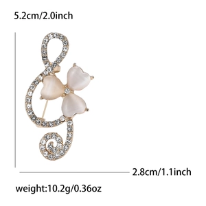 Elegant treble clef musical note brooch with rhinestones and opal heart stones