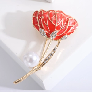 Elegant water lily flower brooch with red enamel and white pearl on a white background