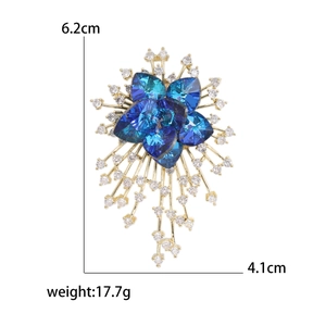 Elegant gold flower brooch with blue crystal hearts and white zircon, size 6.2cm x 4.1cm