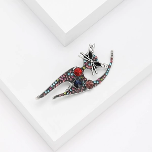 Close-up of elegant cat brooch with colorful rhinestones on silver alloy base