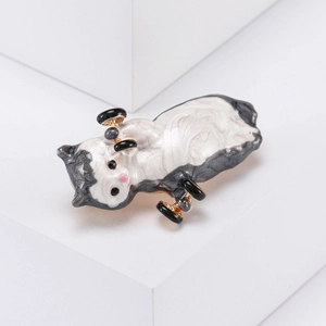 Cute enamel cat brooch holding dumbbells with minimalist aesthetic background display