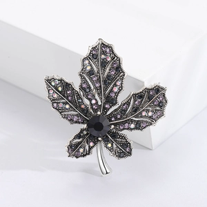 Exquisite maple leaf brooch with purple and black rhinestones on a vintage alloy base