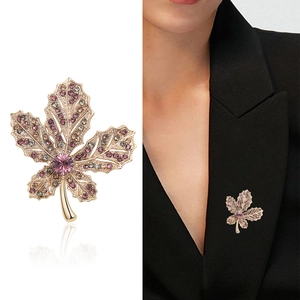 Exquisite gold maple leaf brooch with vibrant purple and pink crystals for suits