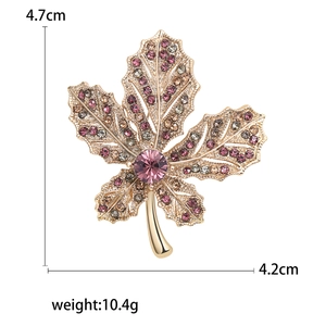 Elegant maple leaf brooch with colorful rhinestones in gold setting, size 4.7cm by 4.2cm