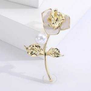 Elegant gold rose brooch with grey enamel petals and a large white pearl for suits