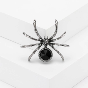 Retro rhinestone spider brooch in gunmetal finish with large black faceted gemstone