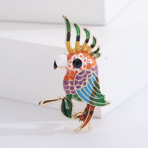 Colorful parrot brooch in gold alloy with enamel drip and sparkling black rhinestone