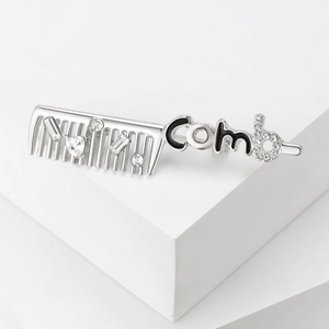 Creative silver comb brooch with rhinestones and black enamel Comb letter design