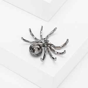 Detailed back view of a dark gunmetal spider brooch with secure pin clasp and crystals