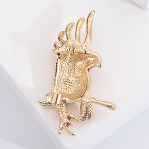 Detail view of the gold-plated alloy parrot brooch back featuring a secure pin fastener