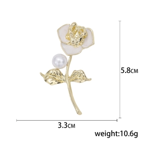 Elegant camellia flower brooch in gold alloy with white enamel petals and pearl detail