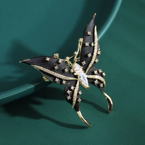Spilla a farfalla elegante in smalto nero con zirconi incastonati su base in metallo