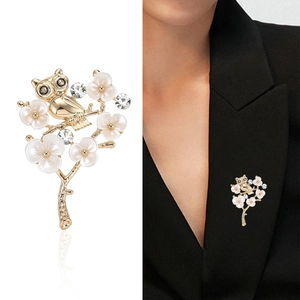 Elegant owl and white flower brooch on a golden branch for suit lapel and coat