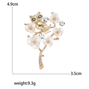 Elegant owl on plum branch brooch with white enamel petals and rhinestones, 4.9cm x 3.5cm
