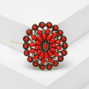 Broche fleur bohème vintage avec strass rouges et finition en or antique
