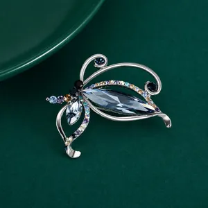 Elegant silver butterfly brooch with deep blue crystal inlay for wedding dresses