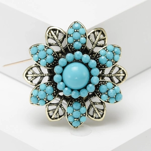 Vintage bohemian flower brooch with turquoise beads and antique bronze hollowed petals