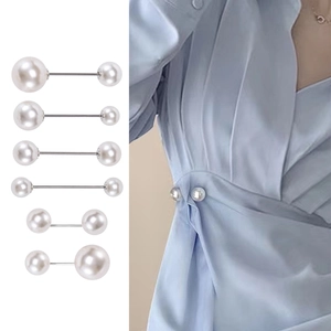 Set of six minimalist pearl brooches for waist adjustment on light blue dress