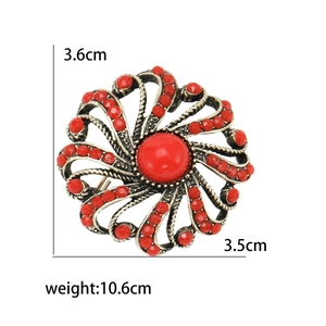 Vintage round floral brooch with red resin inlay and antique gold finish, 3.6cm size