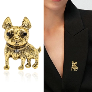 Vintage gold bulldog brooch with intricate textures and sparkling zircon on suit lapel