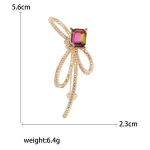 Broche nœud en strass élégante avec pierre précieuse dégradée et finition dorée, 5,6cm