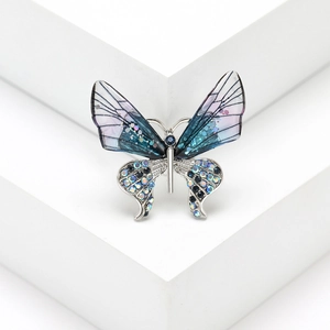 Elegant butterfly brooch with blue-purple gradient wings and sparkling rhinestones