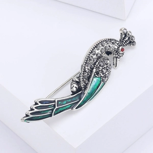 Broche paon vintage en argent antique avec émail vert et accents de cristal brillant