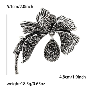 Detail view of retro rhinestone flower brooch with pear-cut drop pendant and dimensions