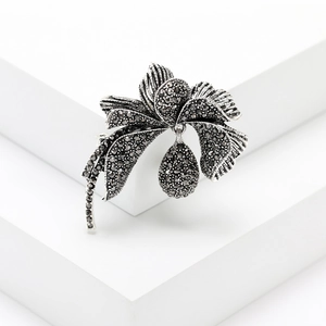 Vintage silver flower brooch with black crystals and a water-drop pendant for women