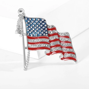Detail of waving American flag brooch with enamel colors and sparkling rhinestones