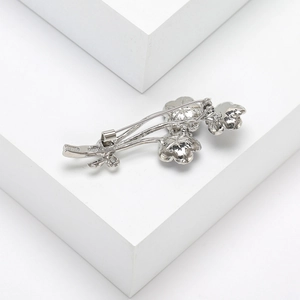 Detailed view of the silver flower bouquet brooch pin with a polished metallic finish