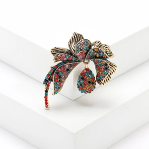 Vintage retro gold alloy bow brooch with colorful rhinestones and teardrop pendant