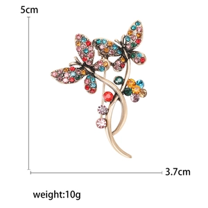 Vintage gold butterfly brooch with multicolored rhinestones and clear size markings