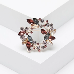 Elegant crystal olive wreath brooch featuring multicolored rhinestones on a gold metal base