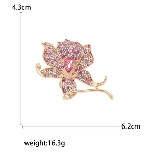 Luxurious flower brooch with pink crystals and white rhinestones on white background