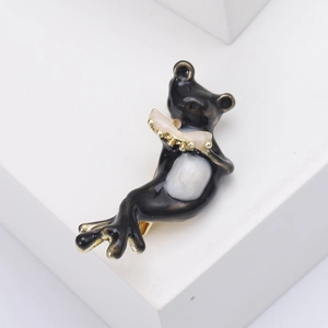 Süße schwarze Emaille-Frosch-Brosche beim Lesen eines Buches mit Goldbeschichtung