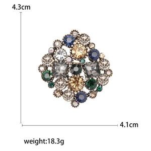 Vintage round floral rhinestone brooch with multicolor crystals in bronze setting