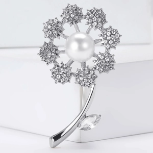 Elegant dandelion silver brooch with crystal petals and a central white pearl detail