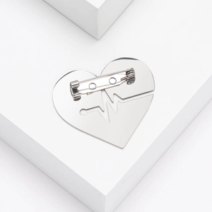 Detailed back view showing secure pin closure on silver heartbeat heart brooch
