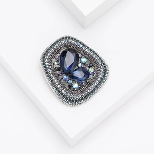 Vintage geometric brooch with deep blue pear-cut crystals and colorful rhinestones