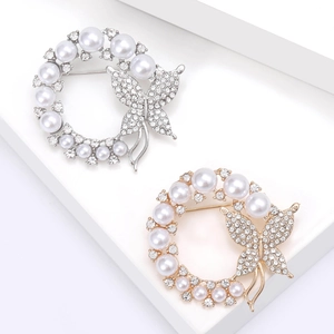 Elegant silver and gold butterfly wreath brooches with white pearls and sparkling zircons