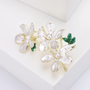 Elegant peach blossom enamel flower brooch with white petals and pearls in gold finish