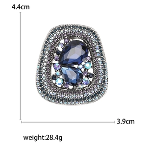 Vintage geometric brooch with deep blue pear-cut crystals and colorful rhinestones