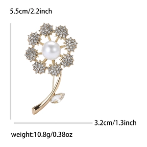 Elegant rhinestone dandelion brooch with white pearl center and golden stem on white background