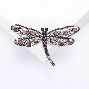 Elegant vintage hollow dragonfly brooch with purple and pink crystals on silver base