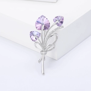 Detailed view of bouquet brooch with purple heart crystals and zircon bowknot inlay