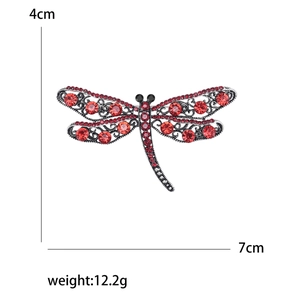 Fashionable dragonfly brooch with red crystals and silver hollow wings, 7cm width