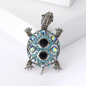 Broche tortue argentée vintage ornée de strass bleus et d'épingle en cristal animalier