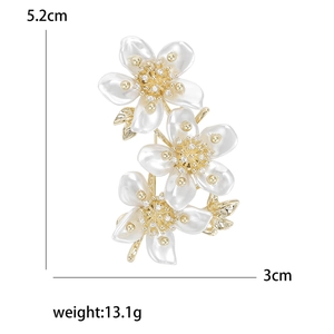 Elegant gold flower brooch with white petals and crystals, size 5.2cm by 3cm
