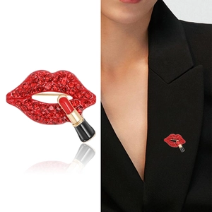 Sparkling red rhinestone lip and lipstick brooch pinned on a black suit lapel